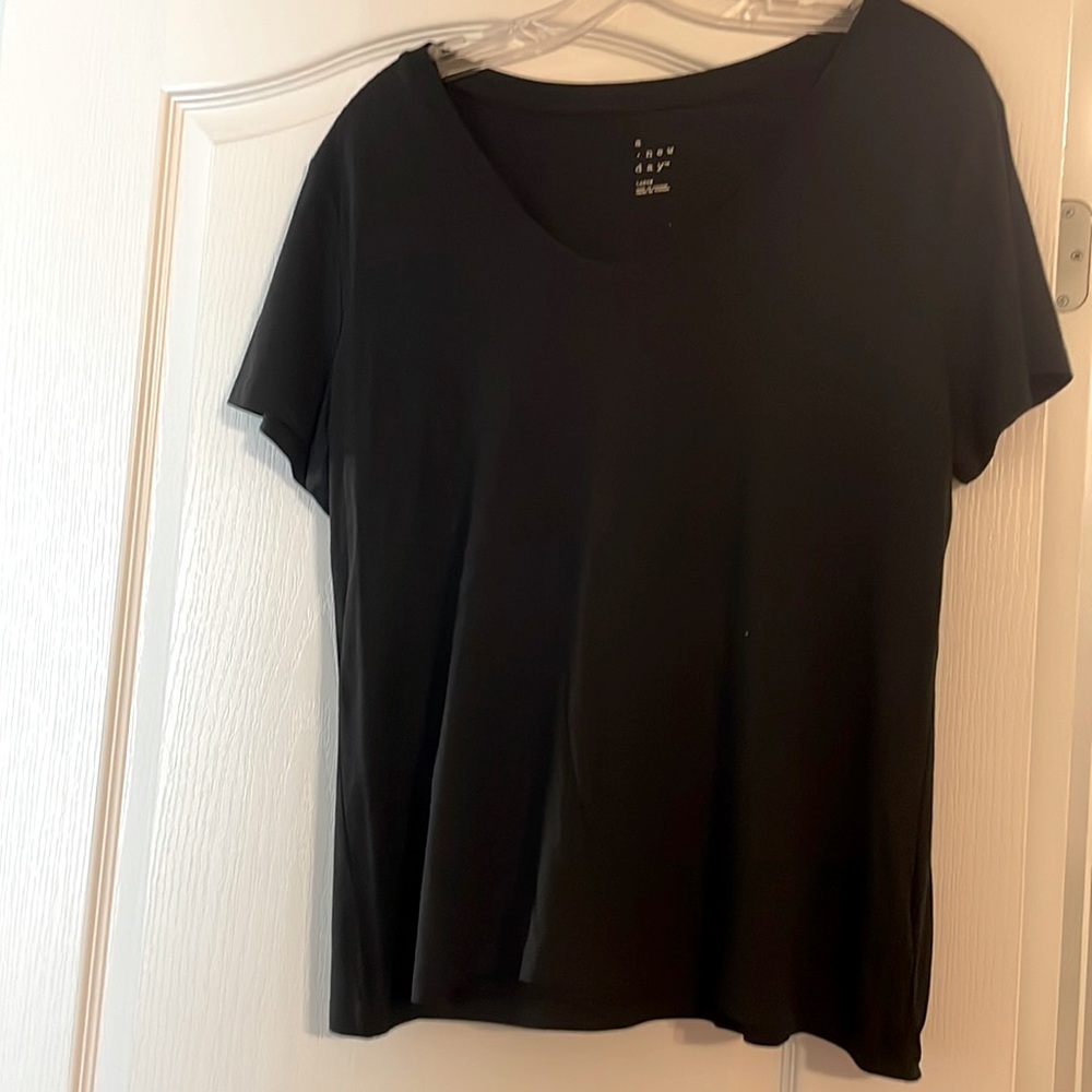 Never worn. Black short sleeve t-shirt.